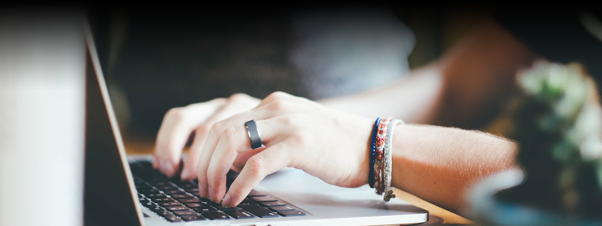 person typing on laptaop